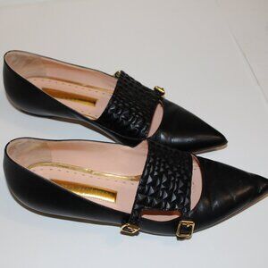 Black leather pointed flats